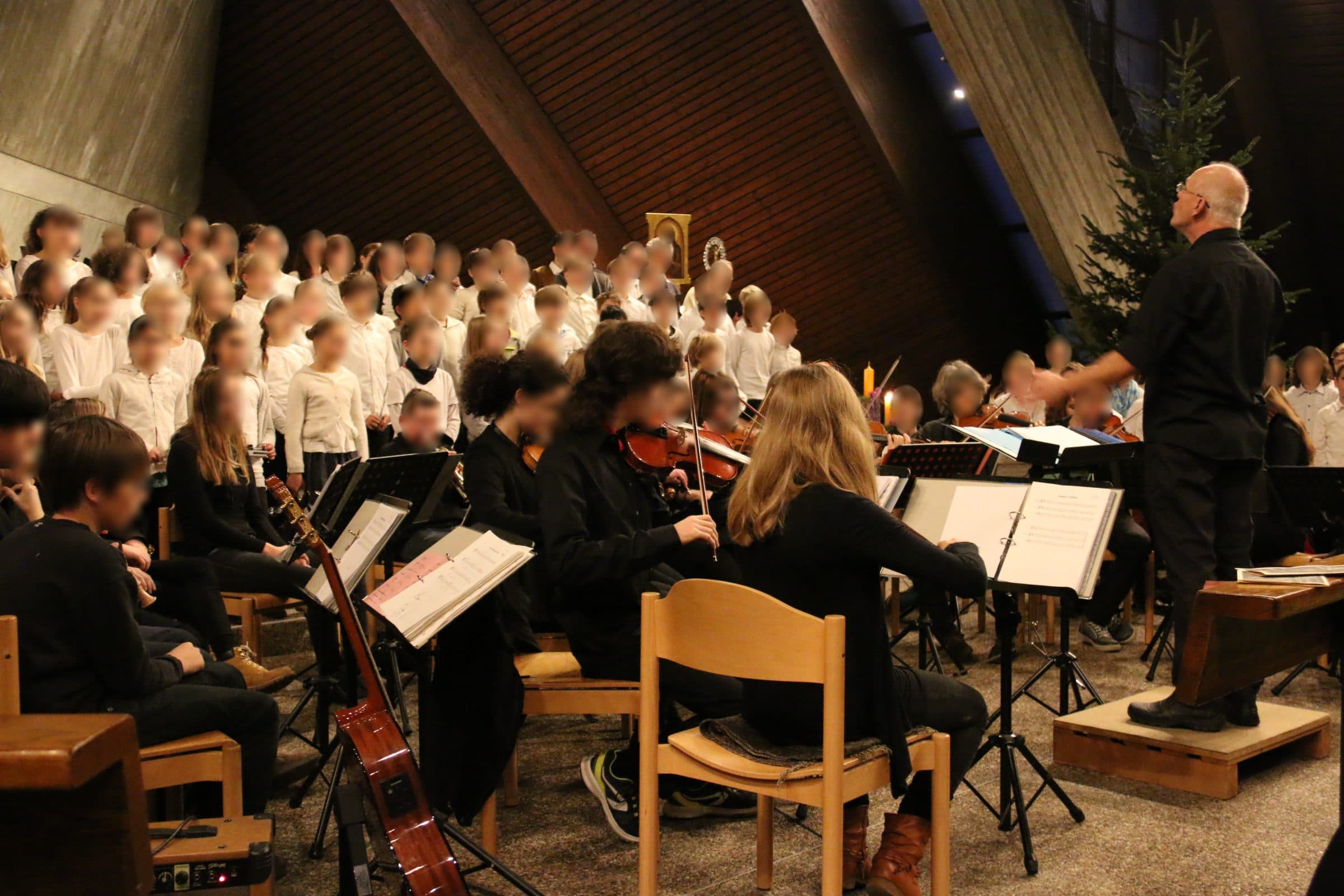 School choir and orchestra performing at the Christmas concert
